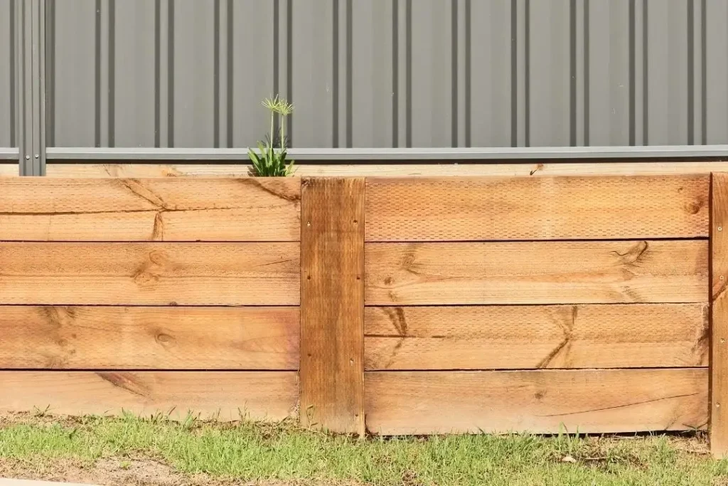 timber retaining walls and a fence